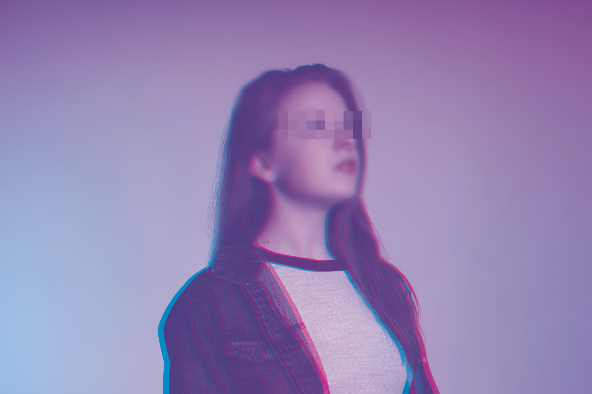 Portrait of a young woman with long hair wearing a denim jacket and a light t-shirt, standing against a purple-blue gradient background; the image features a glitch blur effect over the eyes, color distortion outlining the model's edges, and an overall slightly blurred, dreamlike focus.