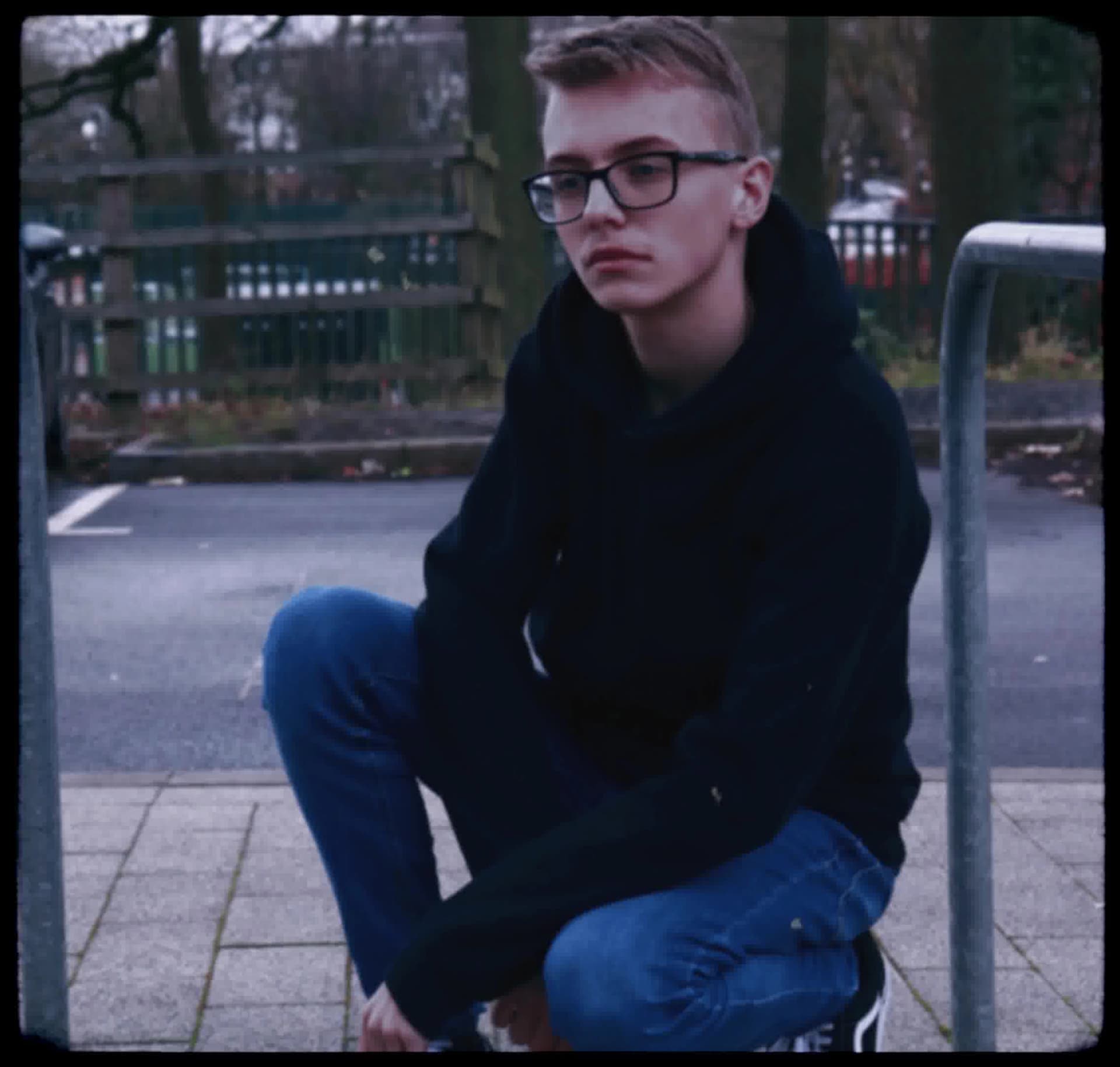 Vintage, film-like photography style with muted colors, soft focus, heavy grain, and black rounded borders, evoking a nostalgic, documentary feel.