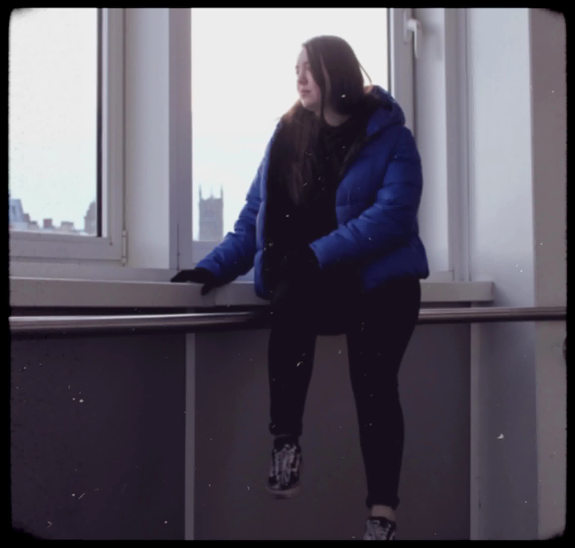 Vintage, film-like photography style with muted colors, soft focus, heavy grain, and black rounded borders, evoking a nostalgic, documentary feel.