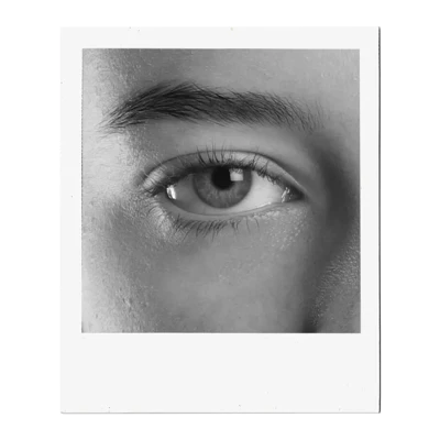 A close-up, black and white photograph captures the intricate details of a human eye. The iris, a mesmerizing mix of light and dark tones, surrounds a dark pupil, reflecting subtle highlights. Delicate eyelashes frame the lower eyelid, while the upper lid is partially visible, casting a soft shadow. Above the eye, a well-defined eyebrow adds structure to the face. The surrounding skin shows fine texture and subtle shading, emphasizing the eye as the focal point. A close-up, black and white photograph captures the intricate details of a human eye. The iris, a mesmerizing mix of light and dark tones, surrounds a dark pupil, reflecting subtle highlights. Delicate eyelashes frame the lower eyelid, while the upper lid is partially visible, casting a soft shadow. Above the eye, a well-defined eyebrow adds structure to the face. The surrounding skin shows fine texture and subtle shading, emphasizing the eye as the focal point.
